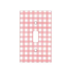 a pink and white checkered light switch cover