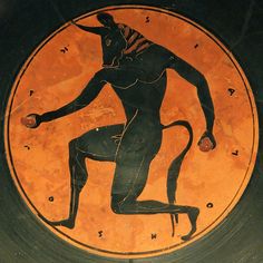 an ancient greek vase with a man holding a ball