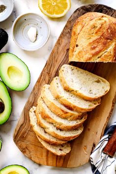 sliced bread and avocado on a cutting board