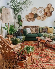 a living room filled with furniture and lots of plants