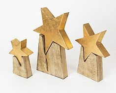 three wooden stars on top of each other