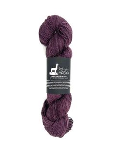 a skein of purple yarn on a white background