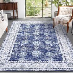 a blue and white rug in a living room