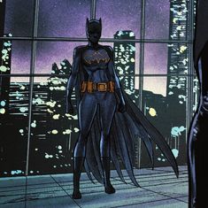 the batman animated character is standing in front of a window with city lights behind him