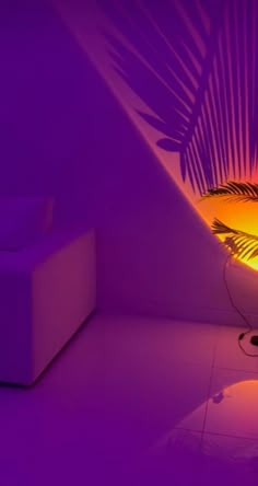 a purple room with a plant in the corner and an orange light coming from behind it