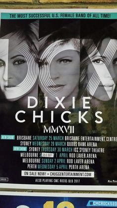 the poster for dixie and chixkie's concert in front of a brick wall