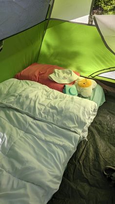 an open tent with a sleeping bag in it