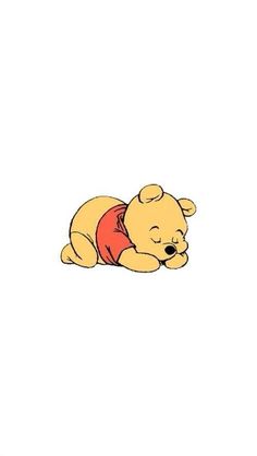 winnie the pooh is laying down on his stomach