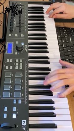 two hands are playing an electronic keyboard