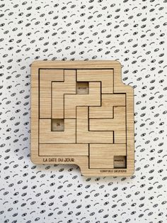 a piece of wood that is shaped like a puzzle