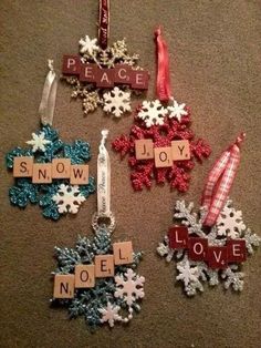 christmas ornaments made from scrabbles on the floor with words that spell out peace and joy