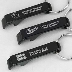 three personalized bottle openers sitting next to each other