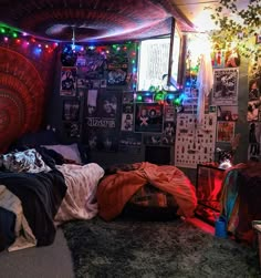 a bedroom with lots of lights and posters on the wall