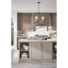 a kitchen with gray cabinets and white counter tops