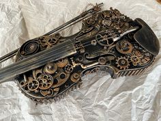 an old violin made out of metal gears