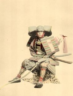 an old fashion photo of a man with two swords and a hat on his head