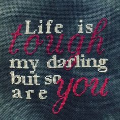 the back of a sweater that says life is tough, my doing but so are you