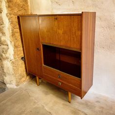 an old wooden cabinet with two drawers