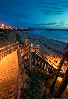 stairs leading down to the beach at night