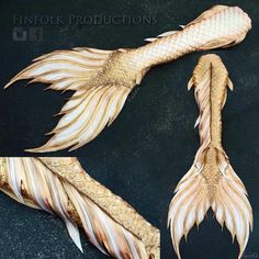 an image of two fish made out of wood and gold leafy material on black background