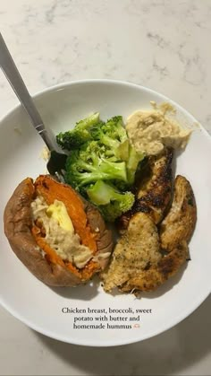 chicken breast, broccoli, sweet potato and potatoes on a white plate