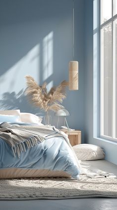 a bedroom with blue walls and white bedding