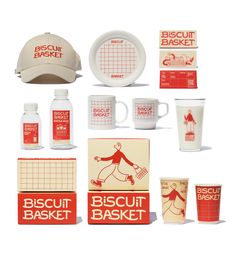 the biscuit basket is displayed with cups and saucers, including a baseball cap