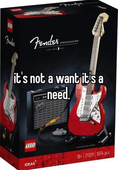 a red guitar and amp in a box with the caption it's not a want it's a need