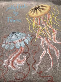 a chalk drawing of jellyfish and an umbrella on the sidewalk with words written below it