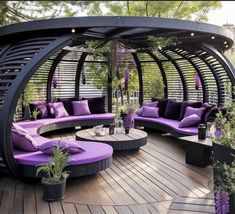 a purple couch sitting on top of a wooden deck