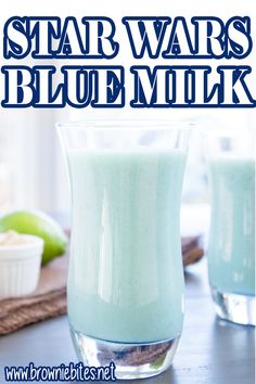 a close up of a drink in a glass on a table with the words star wars blue milk