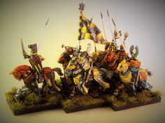 a group of knights on horses with flags