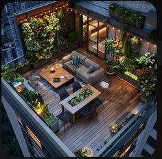 an aerial view of a living room and dining area with plants on the roof deck