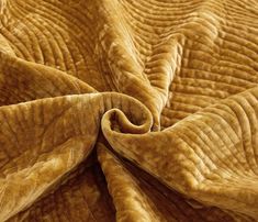 a close up view of the fabric on an elephant's skin quilted blanket