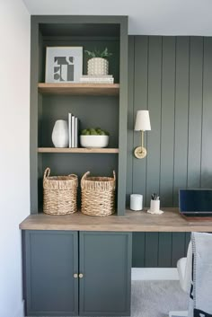 a desk with two baskets on top of it