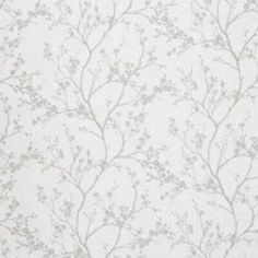 a white wallpaper with small flowers on it