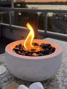 a fire pit sitting on top of a table