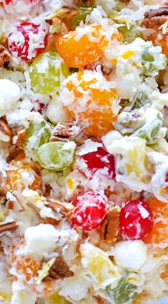 a bowl filled with fruit salad on top of a table