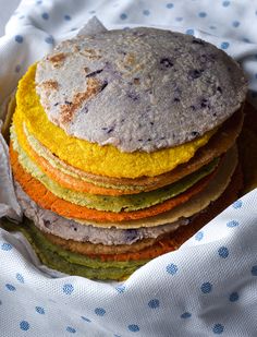 a stack of food sitting on top of a bed