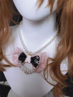 The necklace features a pink bear charm, as well as a double bowknot with a day bead chain as a match, and a heart charm on the chain.  This price is for a necklace only. Pink Bear, The Necklace, The Chain, Bead Chain, A Necklace, Kawaii Fashion, Beaded Chain, Bead Necklace, A Heart