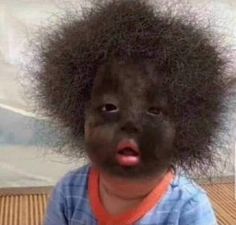 a young child with an afro on it's head and the caption, what do you think?