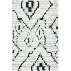 a black and white rug with an intricate design on the bottom, in front of a white background