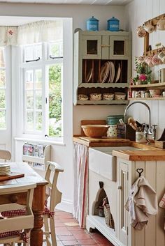 the kitchen is clean and ready to be used for cooking or baking, while also being used as a dining room