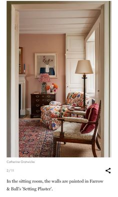 a living room filled with furniture and a lamp