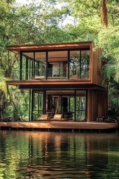 a house on the water surrounded by trees