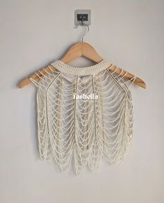 Beautiful Off white/ Ivory Pearl Shoulder Cape with gold embellishments! One size fits all.  SHIPPING DETAILS  Our shop is based in India. We ship domestically as well as internationally. For international orders, free shipping for blouses is available via India Post and it takes about 15-20 business days to deliver. Faster shipping is available for 25 USD via Speed post and it will take about a week to deliver.  For domestic orders, shipping is free. And once an item is dispatched, it will take about a week to deliver.  DISCLAIMER  The actual color of the product might slightly differ from the image due to photographic lighting or monitor's display. Pearl Cape, Bead Bra, Mens Indian Wear, Pearl Top, Body Accessories, Cape Tops, Shoulder Cape, Pearl Accessories, Beautiful Belts