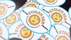 several stickers with cartoon sun faces on them