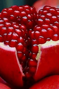 the pomegranate is cut in half and ready to be eaten