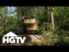 a tree house in the woods with trees around it and text that reads hgtv