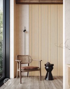 a chair sitting next to a table on top of a hard wood floor in front of a window